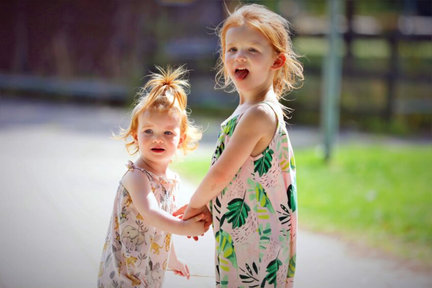 Molly (5) and Ruby-Lou (2) Barty from Dundee playing in the sun on Tuesday.