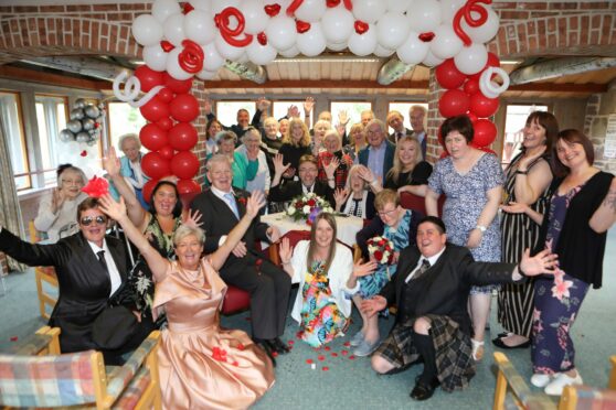Celebrations after Eddie and Ann Bundy renewed their vows at Dalhousie day centre in Brechin. Pic: Gareth Jennings/DCT Media.