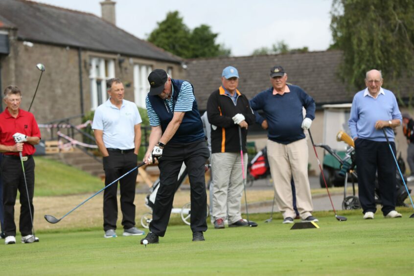 R&amp;A Captain Peter Forster hits his first drive at Forfar.
