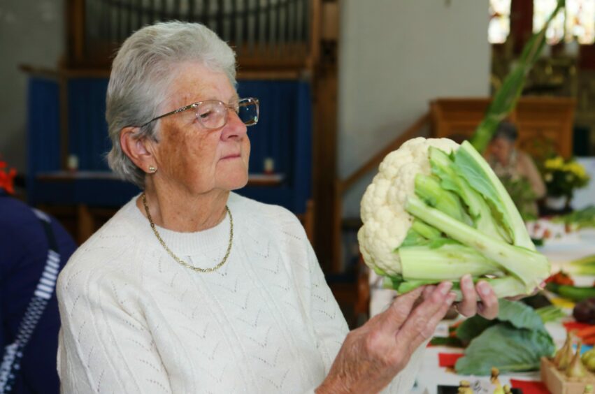 Judge Mary Gray with one of the cauliflower exhibits.