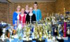 Dancers Lucy Patton, Elizabeth Rudge, Erynn Henderson ,Michalina Maluk and Ashley Morrison proudly display the collection of trophies they have collected. Pictures by Gareth Jennings / DCT Media.