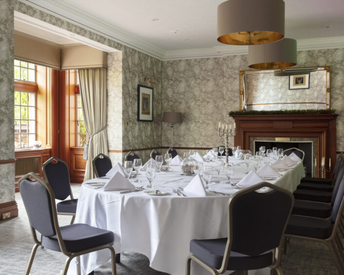 A photo of a beautifully set table in a private dining room at Murrayshall, which is among the best places to eat in Perthshire