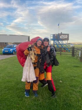 Jacqui, left, back on terra firma after completing the skydive for Bravehound fundraiser.