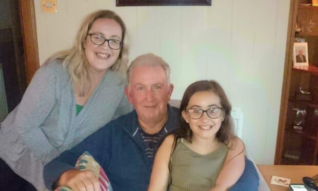 To go with story by Laura Devlin. Derek is taking part in the Dundee Kiltwalk to raise money for the Beatson Cancer Charity.  Picture shows; Derek Young with daughter Sarah and granddaughter Arwyn.  . N/Q. Supplied by Derek Young  Date; Unknown