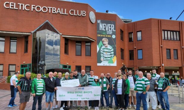 Steve and Yvonne Pert (centre) with members of Montrose Celtic Supporters Club at the end of the walk.