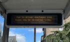 A sign in Dundee city centre on Tuesday warning of service cancellations.