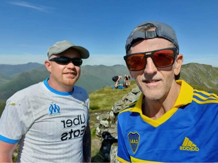 James (left) and pal John-Paul Bell on top of their 7th Munro summit on day one of the challenge.