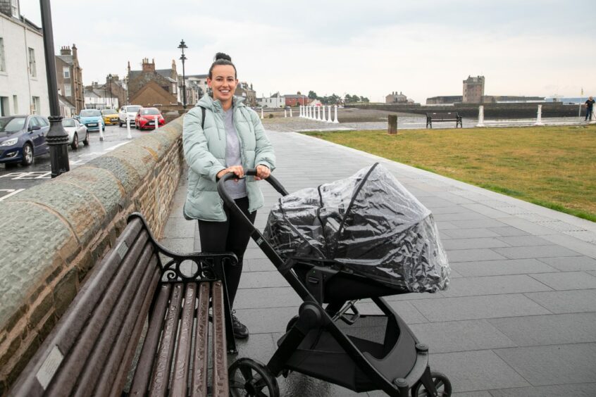 Angela Collins enjoying a stroll along the waterfront while her seven month old son Archie has a nap.