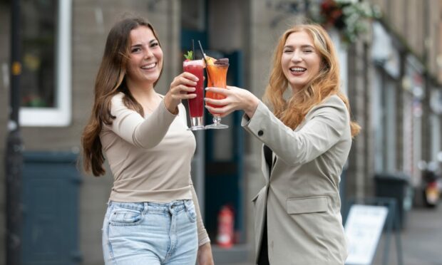 Grace McCandlish and Alice Christison of Marketing After Dark toast the launch of Dundee Cocktail Week which the firm has developed to attract more people into Dundee.