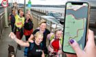 Dundee Kiltwalk 2022 route on mobile phone and 2019 walkers on Tay Road Bridge.
