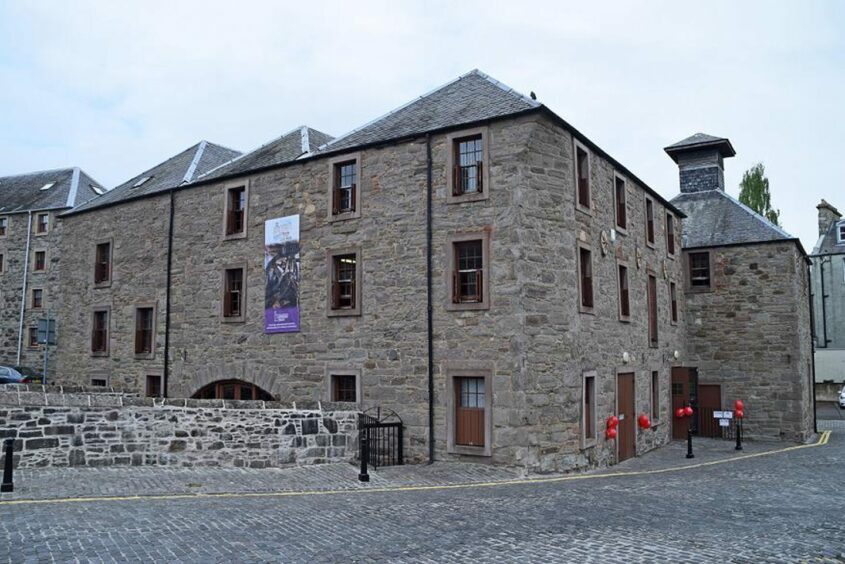 Lower City Mills, a three-story stone building in Perth