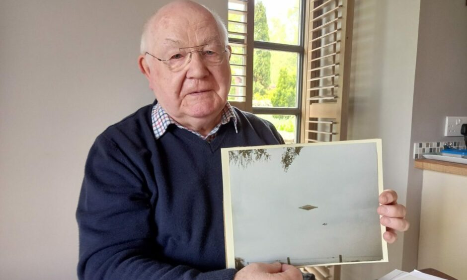 Craig Lindsay with the Calvine UFO photo.