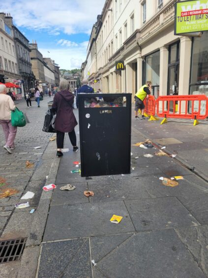 Rubbish gathering on Reform Street in Dundee.