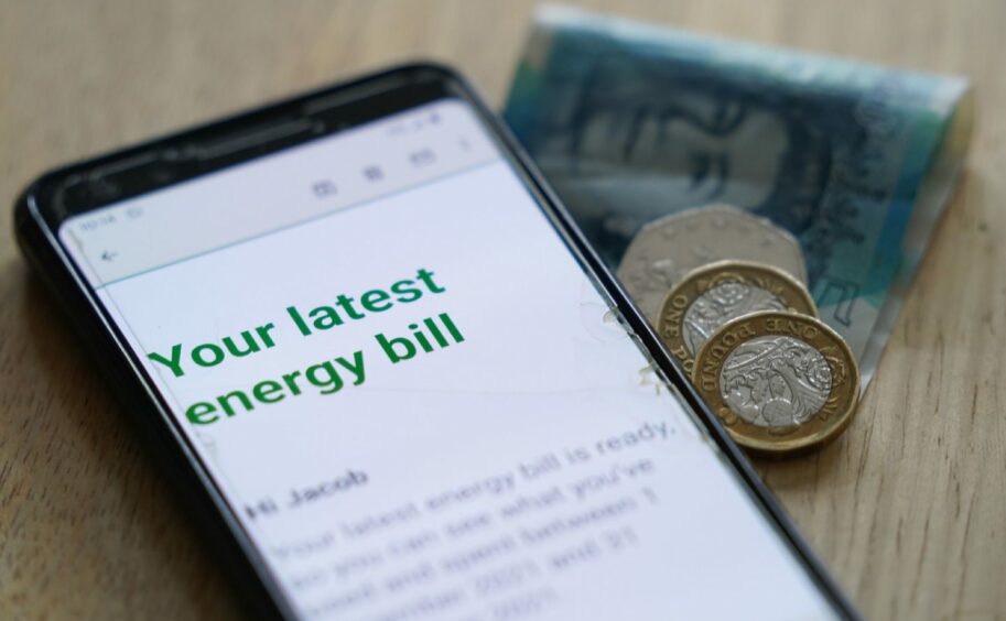 photo shows a mobile phone screen with a message headed 'Your latest energy bill'.