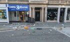 Seagulls picking through the litter left strewn across Reform Street in Dundee.