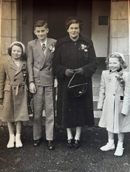 Syd Bassett with his mother and sisters, as a child.