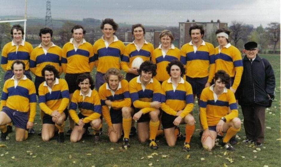 Shown as captain of Stobwell Rugby Club, back row centre.