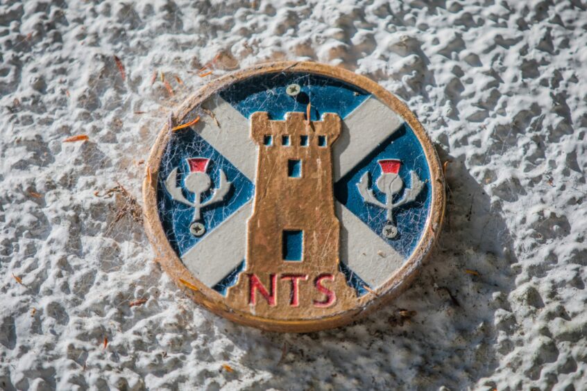 NTS plaque on wall of property in Dunkeld