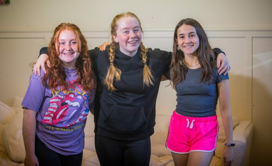 Chorus members (from left) Lucie Grant, Julia Colgan and Isabella Lowrie.