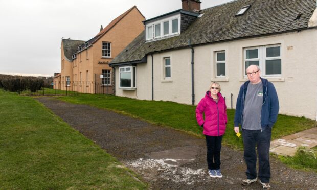 Neighbours Joan Forbes and Chris Main oppose the St Andrews clifftop homes