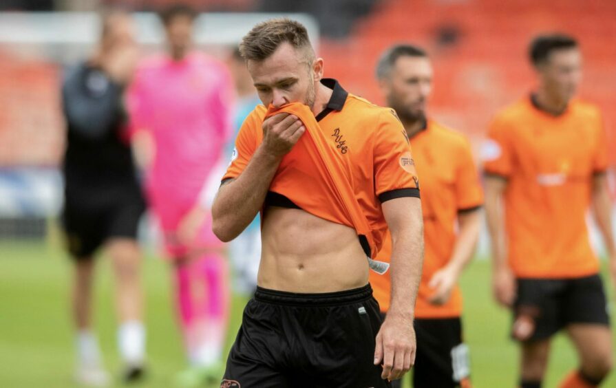A dejected Dundee United defender Scott McMann