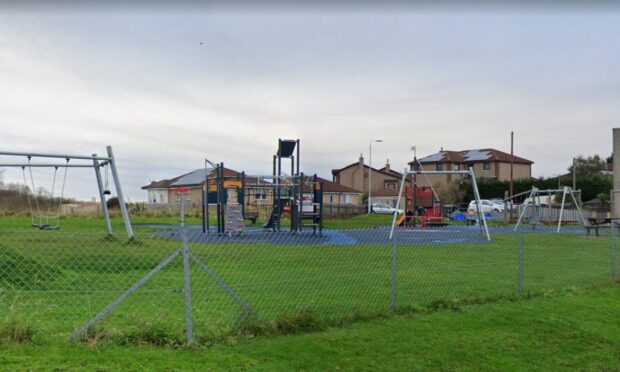 The dad was found lying under swings at a playpark in Inverkeithing