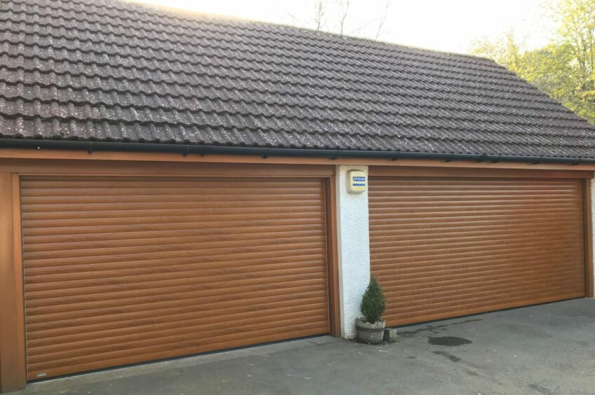 Golden roller garage door from Tayside Garage Doors.
