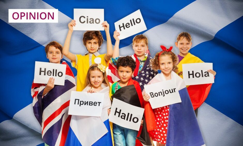 photo shows children holding up signs saying the word 'Hello' in many different languages, against a background of a Scottish saltire flag.