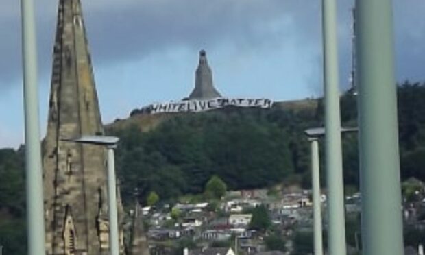 White Lives Matter banner on Dundee Law.