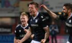Dundee defender Lee Ashcroft celebrates his return to the starting XI with a goal against Falkirk. Image: SNS.