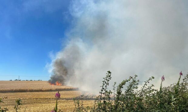 Road closed near St Andrews as four fire crews tackle field blaze