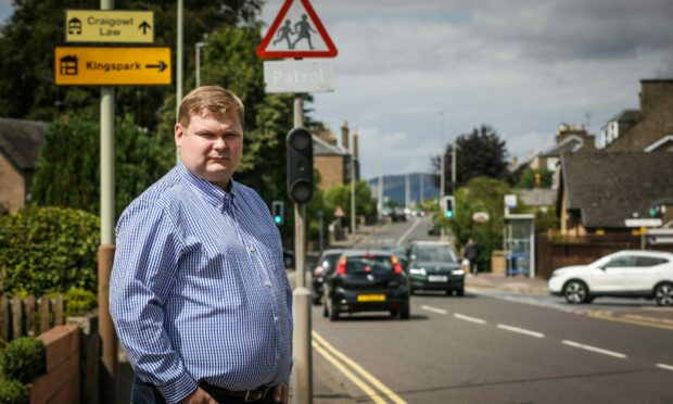Councillor Daniel Coleman has raised the issue of safety fears if lollipop crossings at Downfield Primary are removed. Pic: Mhairi Edwards/DCT Media