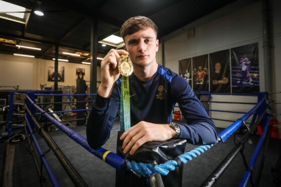 Sam hickey with his Commonwealth Games gold medal.