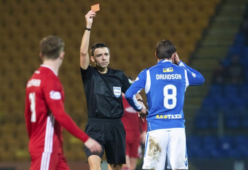 Referee Kevin Clancy shows Murray Davidson his other red card.