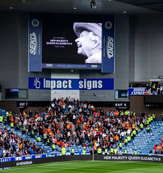 Dundee United fans at Ibrox during the minute's silence.