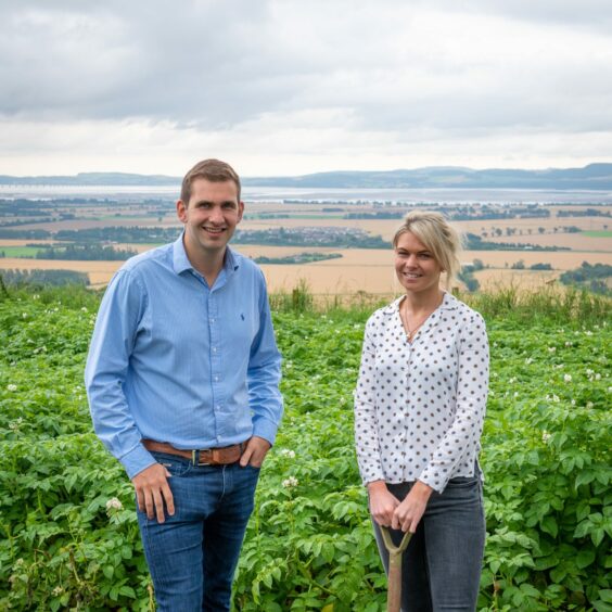 James and Sally Taylor in a potato field