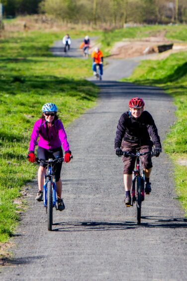cyclists cycling on the Loch Leven Heritage Trail, Kinross