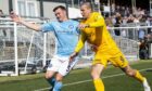 Mark Docherty tussles with Lyndon Dykes, then of Livingston, in his last spell at Forfar.