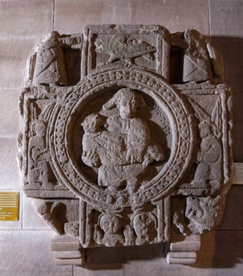 A stone crest inside the building
