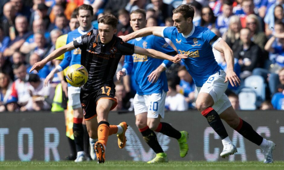 Archie Meekison battles James Sands at Ibrox last term