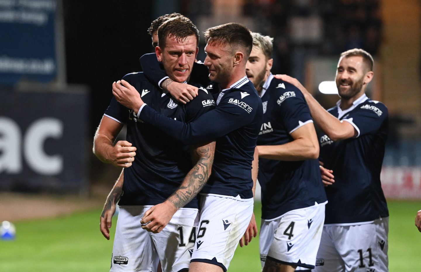 Lee Ashcroft is mobbed by his teammates after scoring against Falkirk in the Premier Sports Cup.