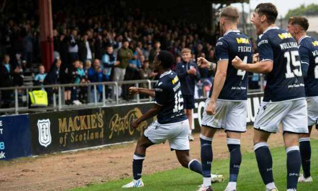 Zach Robinson in front of the South Enclosure after his stellar strike against Queen's Park.