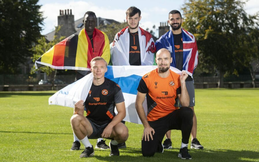 Dundee United's Sadat Anaku, Carljohan Eriksson, Ilmari Niskanen, Dylan Levitt and Aziz Behich with their nations' flags after being called up