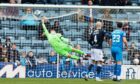 Harry Sharp does his best but can't keep out a wonder striker from Cameron Harper to level the scoring at 1-1.