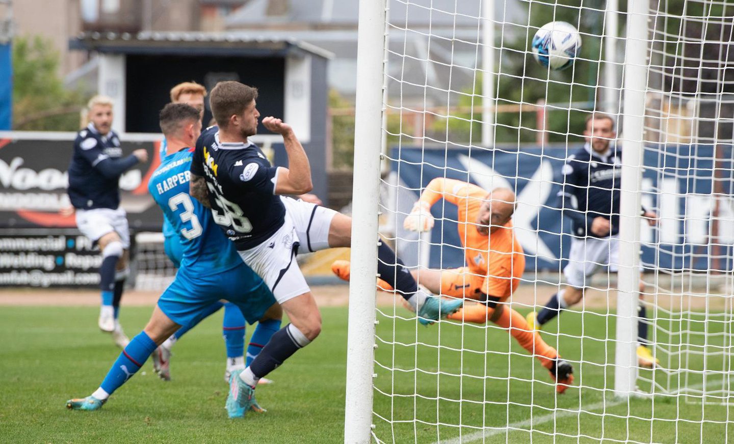 Joe Grayson gets the final touch on a Paul McMullan shot against Inverness.