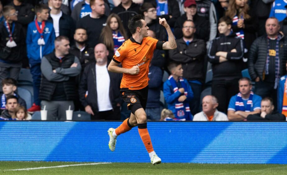 Liam Smith celebrates pulling one back for United at Ibrox