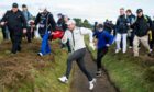Rory McIlroy hurdles the ditch at the 12th during his 68 at Carnoustie.