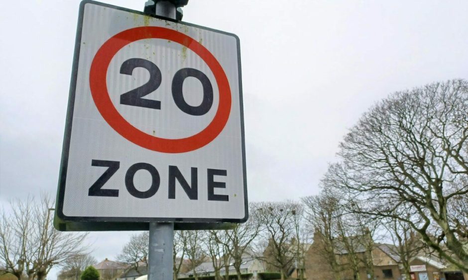 A 20mph zone sign.