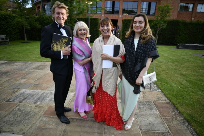 Photo shows Lorraine Kelly and her daughter Rosie Smith attending the opening night of the Glyndebourne Festival with Grant McCahon and Nina Myskow. All are dressed in glamorous evening wear.