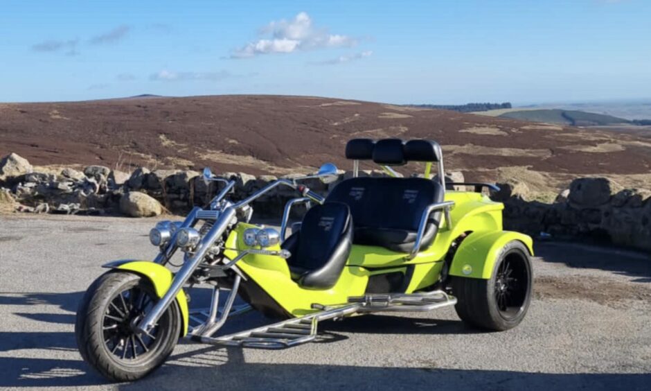 A green Rewaco trike in the Angus hills